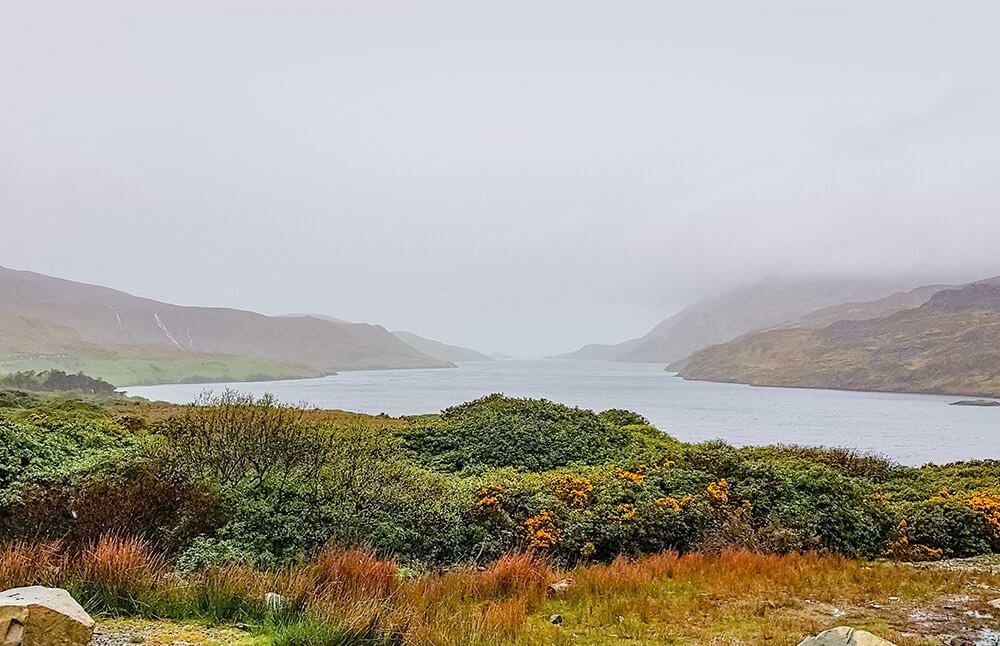 A breathtaking site of a lake and mountains while boondocking.