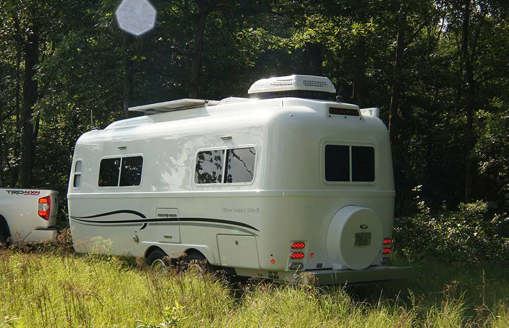 An RV parked while boondocking in a field..