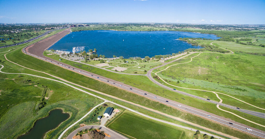 Cherry Creek State Park campground with reservoir and marina in the background.