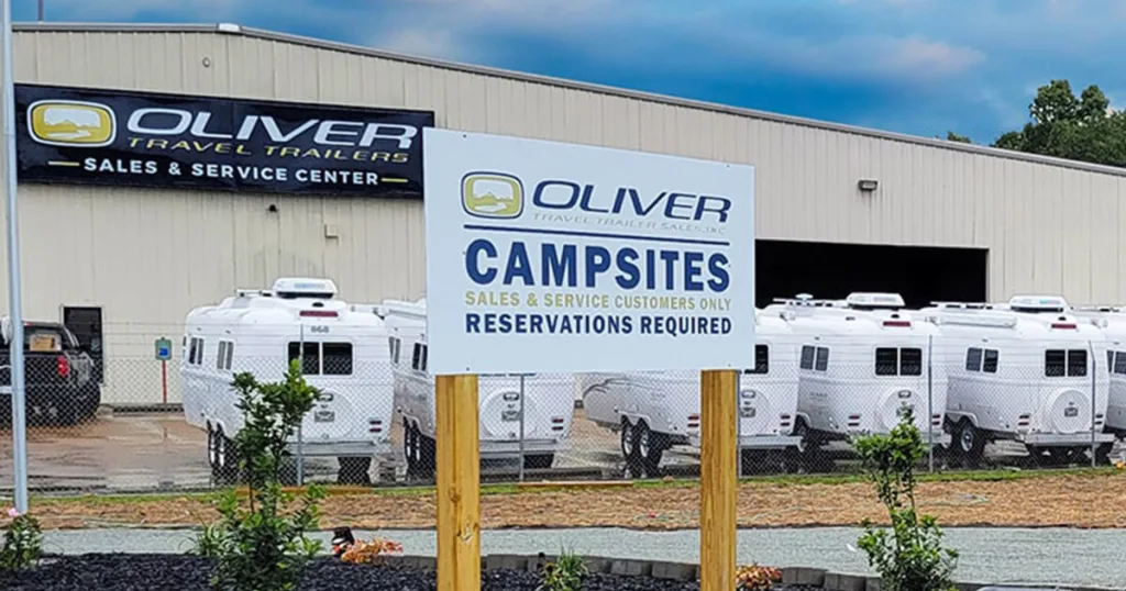 The image also conveys a sense of trust and reliability, highlighting the desirability and long-lasting value of Oliver campers in the resale market.