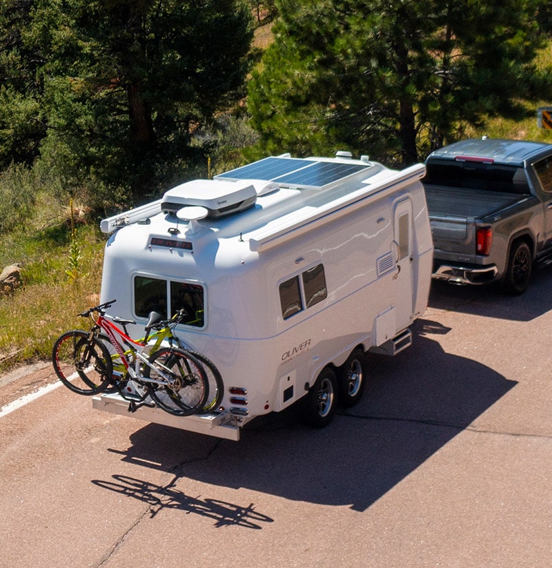 The Legacy Elite II is depicted against the majestic Colorado Mountains, emphatically showing off its sleek design and robust capabilities, as it seamlessly merges with the grandeur of nature promising memorable adventures and explorations.