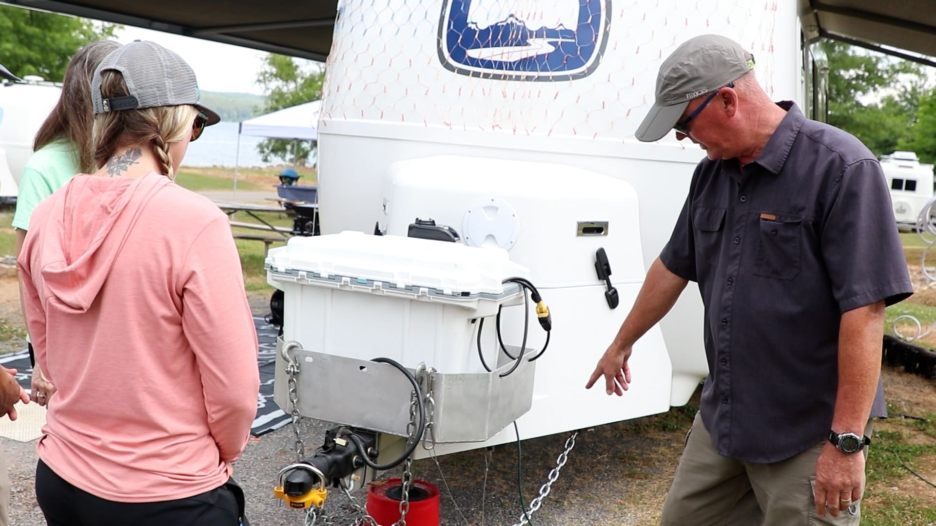 Oliver Customer Showing Travel Trailer To Couple