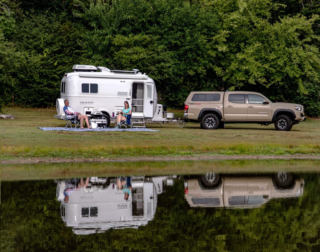 Small camper nestled among the serene woods: A cozy getaway for couples