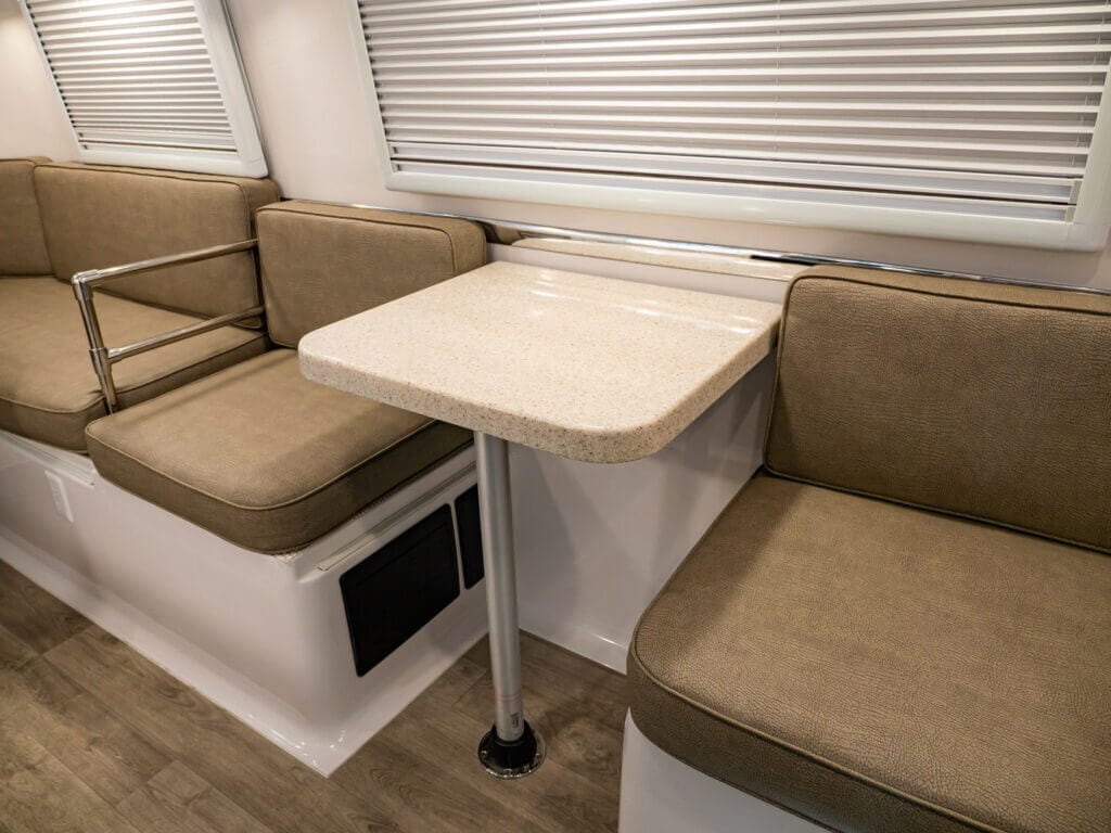 The kitchen dinette for 2 people is a charming and functional space for enjoying meals while on the road.