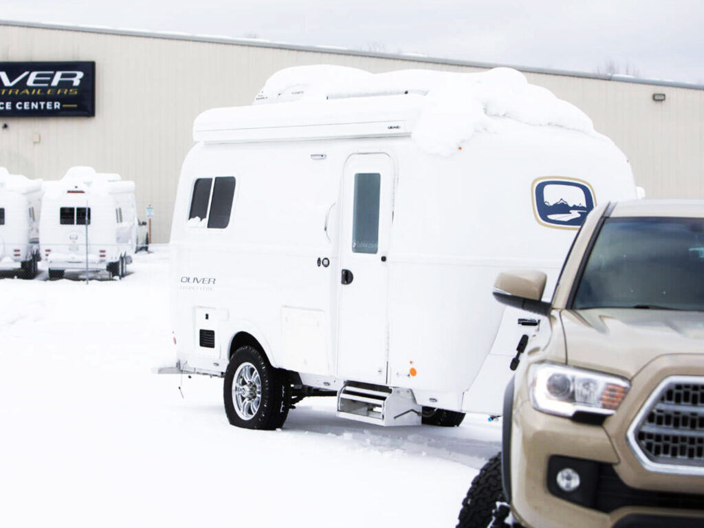 The 2024 Oliver Legacy Elite is equipped for the road with LT tires and self-adjusting electric brakes, providing ultimate climate and weather protection during travel.