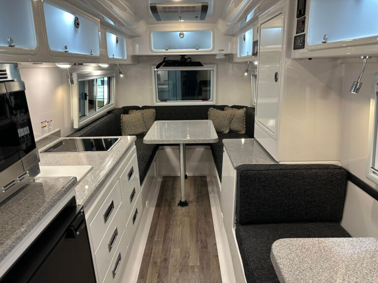 The Legacy Elite II 23 foot RV trailer is perfect for long stays. It features a durable composite hull construction and a spacious interior made of molded fiberglass, ideal for extended journeys.