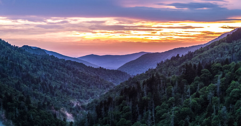 Great Smoky Mountain Sunset Background. Great Smoky Mountain sunset panorama over the many layers and ridges of the beautiful Appalachian Mountains of Tennessee