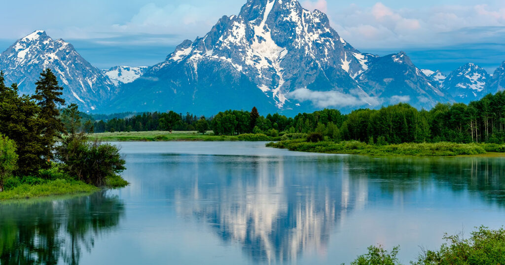 Grand Teton Mountains from Oxbow Bend on the Snake River at dawn. Grand Teton National Park, Wyoming, USA