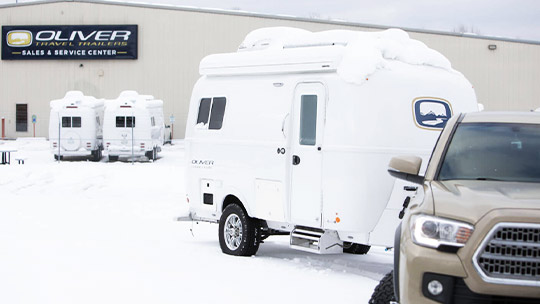 a travel trailer in camping in cold weather