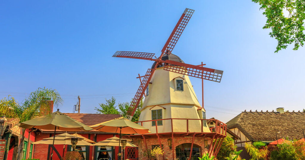 Santa Barbara, California: A stunning windmill in the breeze and iconic red-tiled roofs of Spanish-style buildings.