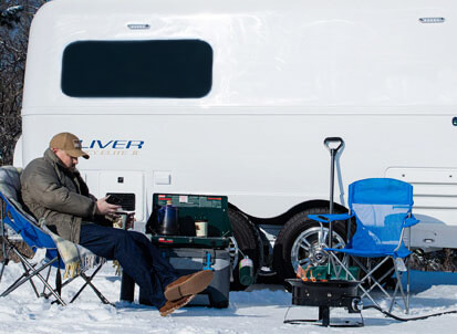 Solo camper relaxing during the winter, Olivers are perfect for solo or couple camping adventures