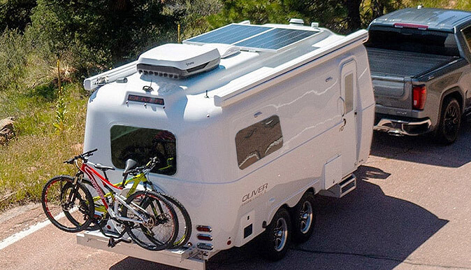 Aerodynamic Oliver trailer towing easily on an open road