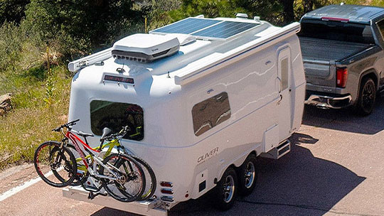 Oliver Travel Trailer with low holding tanks, axle-positioned batteries, and reinforced aluminum frame for stable, effortless towing.