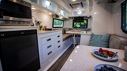 Oliver Travel Trailer with robust fiberglass shell, aluminum frame, and corrosion-resistant steps for durable, low-maintenance premium quality.