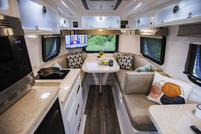 Floor plan of the Legacy Elite small camper showing a dinette converting to a bed.